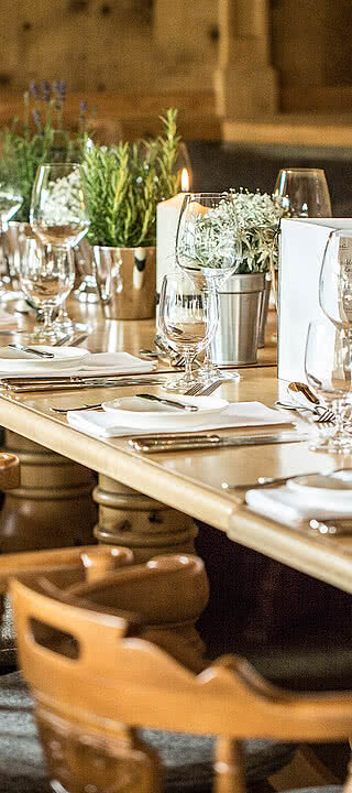 Covered tables in the ‘Wirtsstube’ in the restaurant in Der Schwarzacher Saalbach Hinterglemm