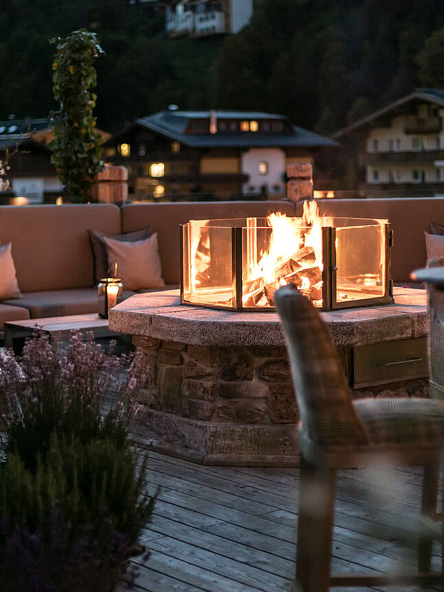 Cosy fire pit on the terrace at Der Schwarzacher in the evening